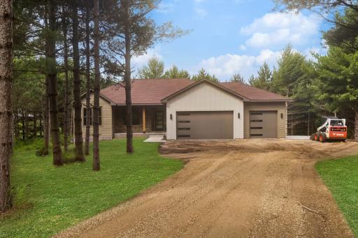 Front of house; this photo has been digitally enhanced. The grass shown in this image is not present at the property and is for visualization purposes only.