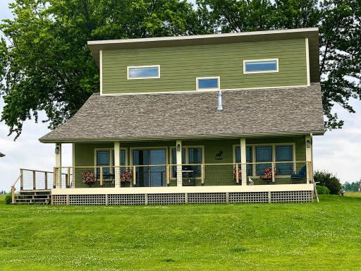 Covered porch with a great view of the lake and the sunrise/sunsets
