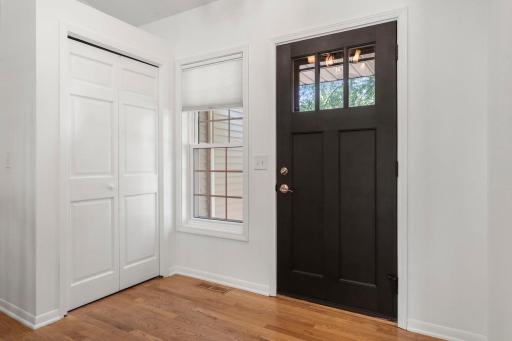 Charming entry way with large window and a closet