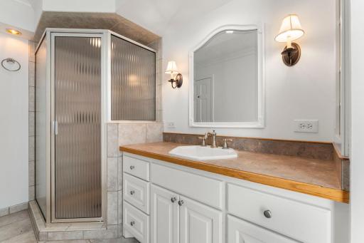 Full bath with skylight, walk-in shower and separate tub