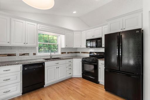 Vaulted ceiling adds to the feeling of space in this lovely kitchen