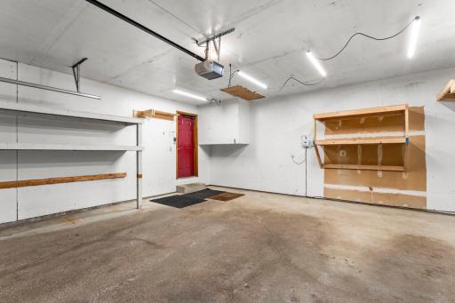 Garage with added shelving perfect for organizing your space