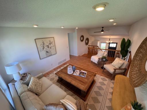 Upper level Living Room with view to entry