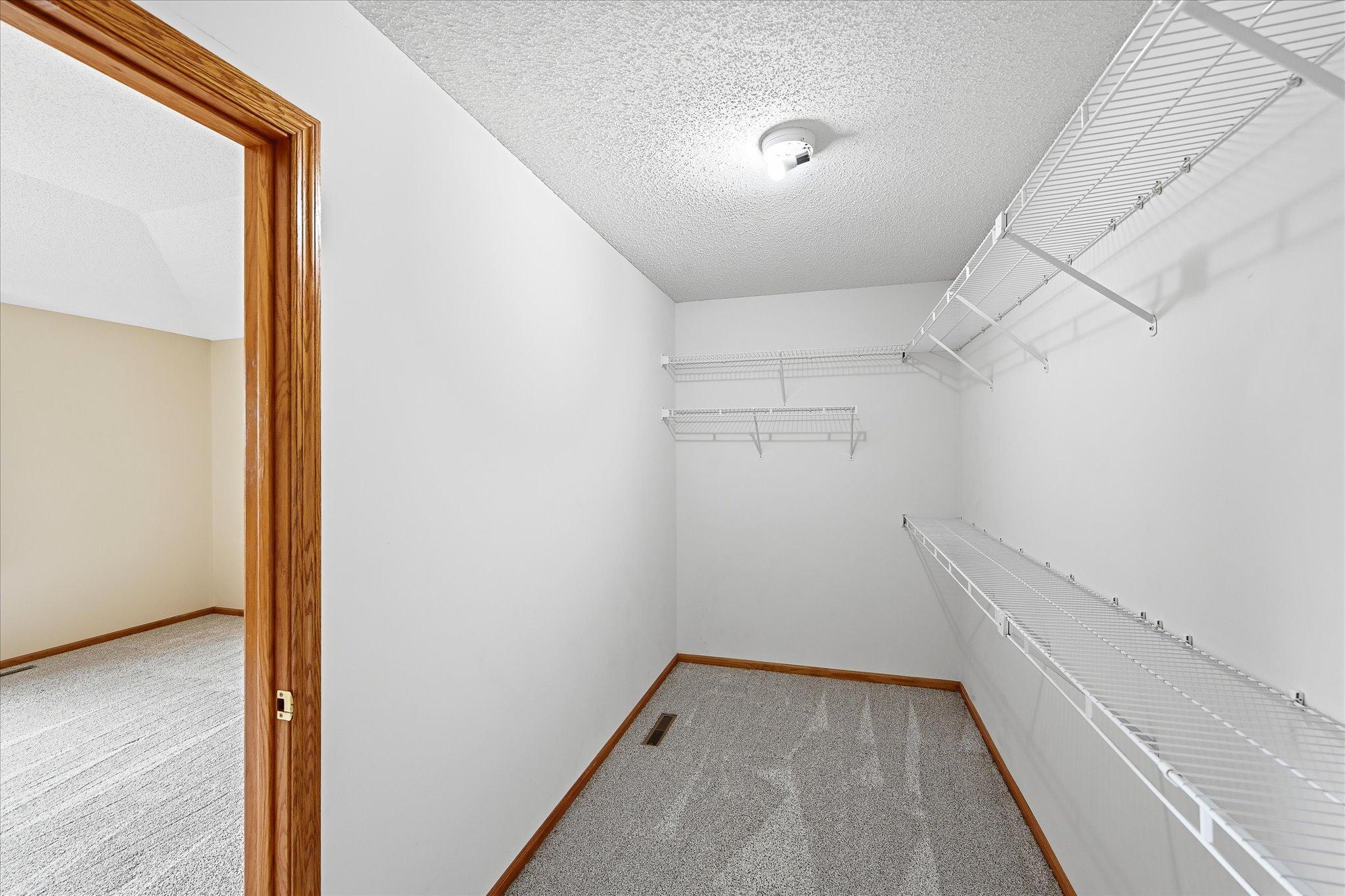 Walk-in closet offers additional space and functionality.