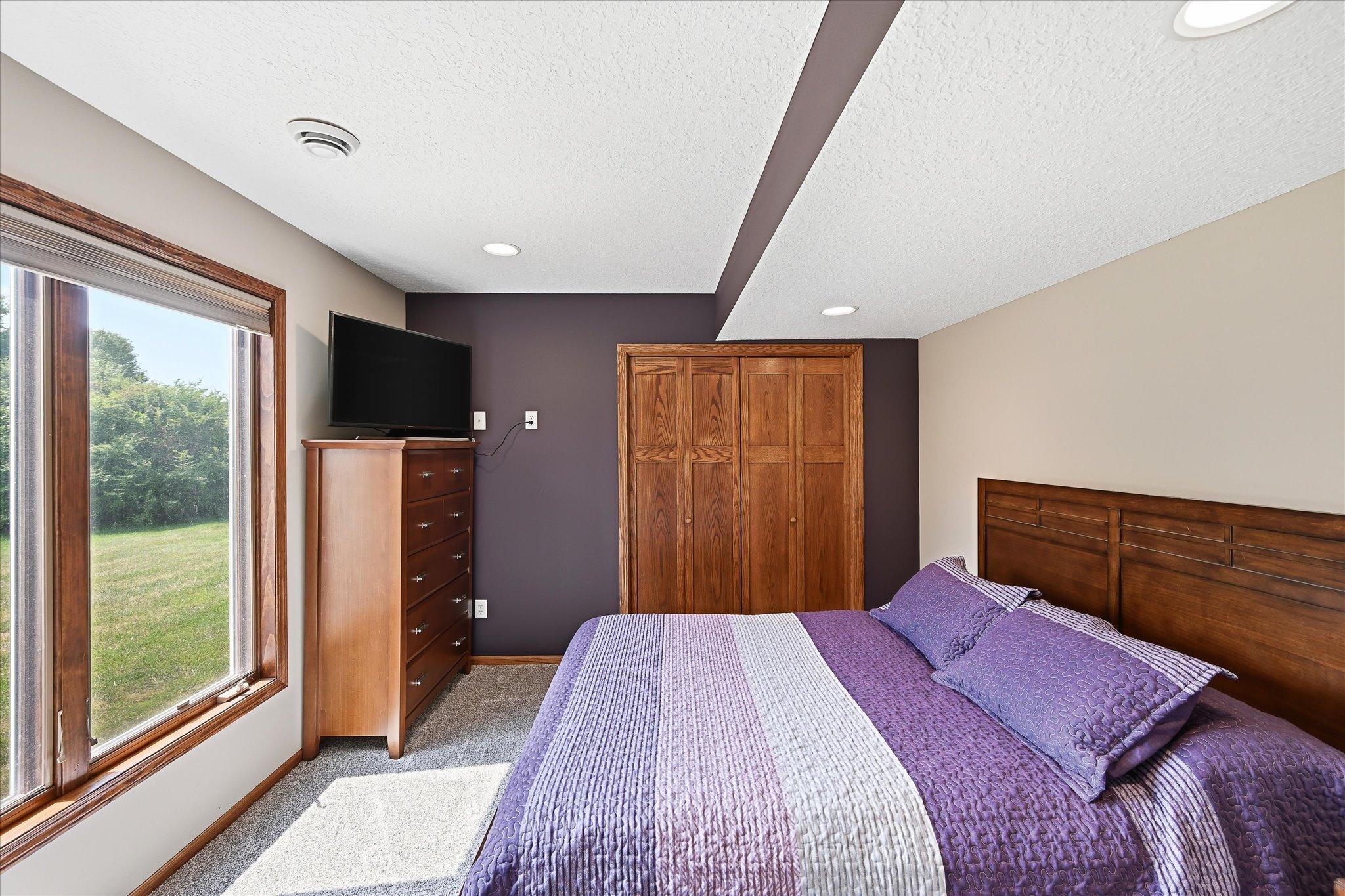 Peaceful bedroom with abundant natural light.
