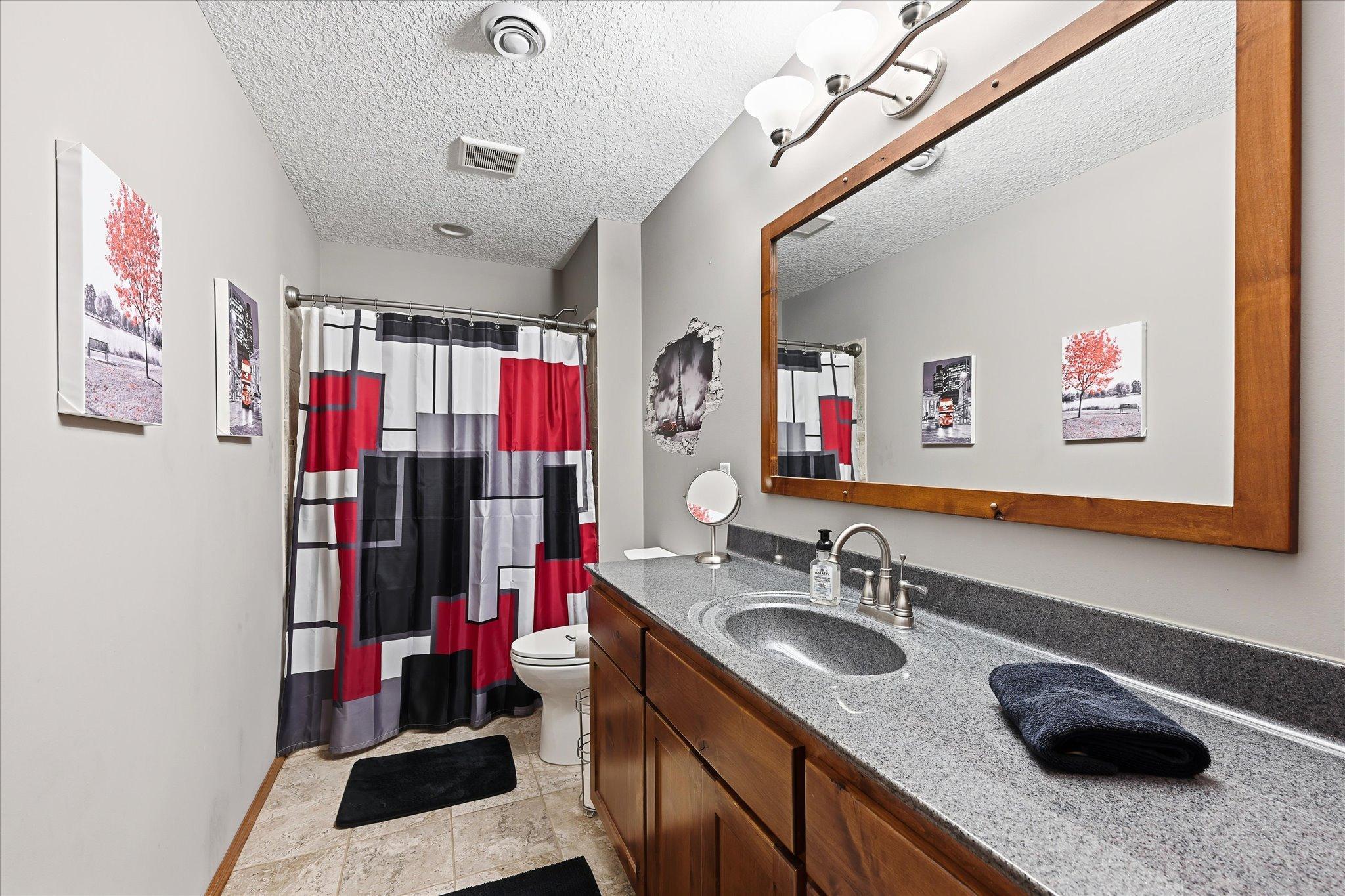 Updated bathrooms with modern fixtures.
