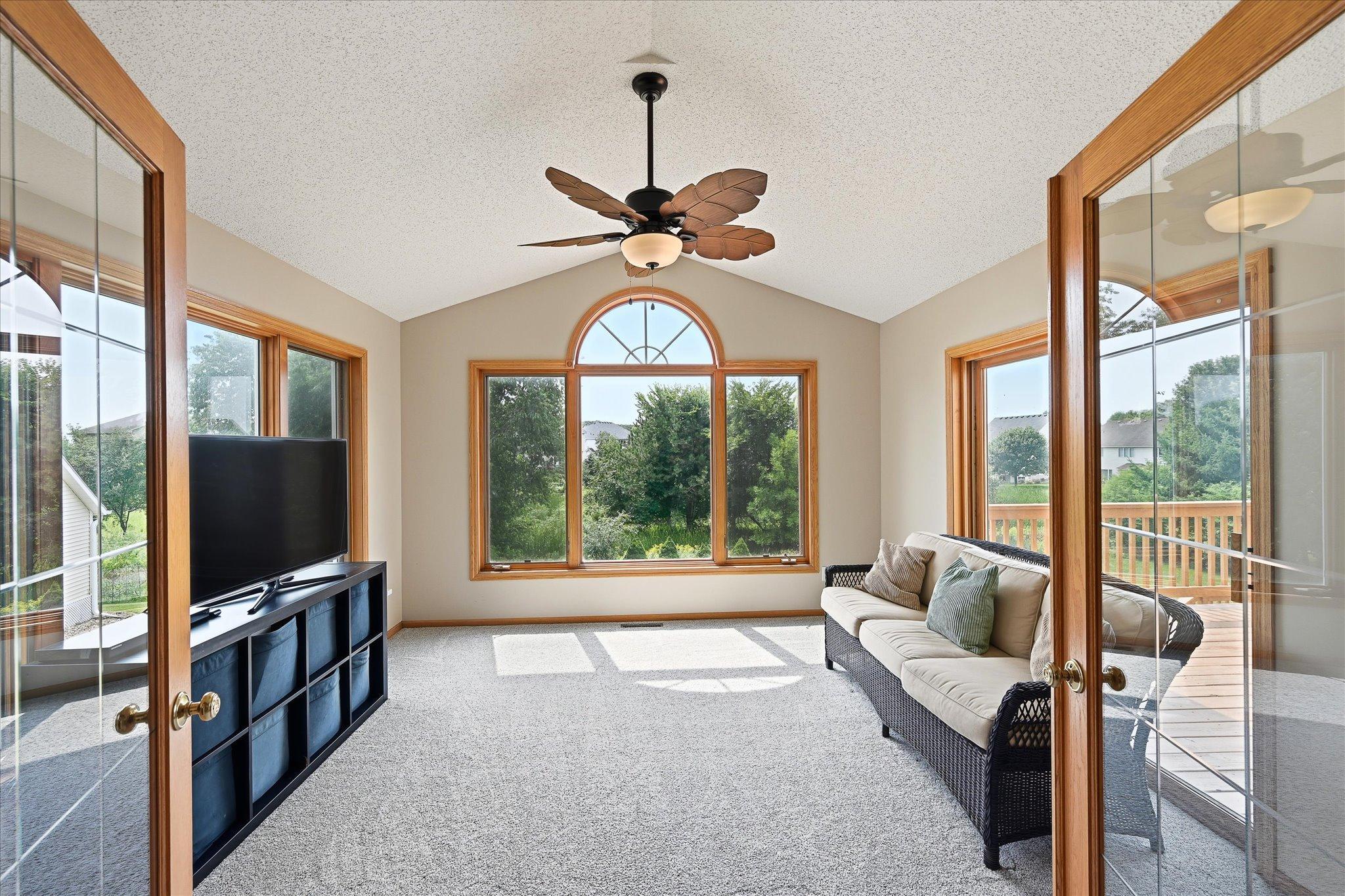 Large picture window frames peaceful outdoor views.