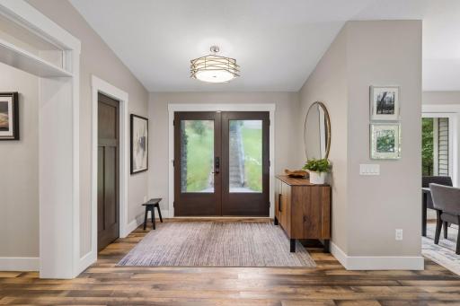 You'll love the double doors to lighted entryway, highlighting the beautiful hardwood floors.