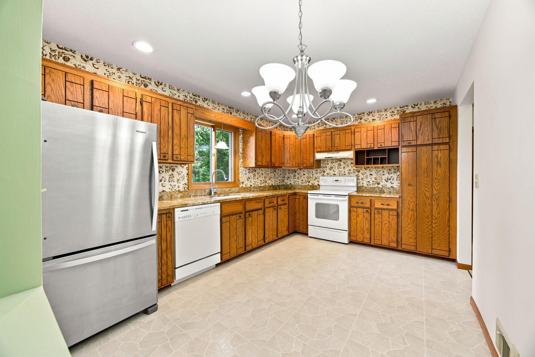 Kitchen has amble cabinetry and pantry.
