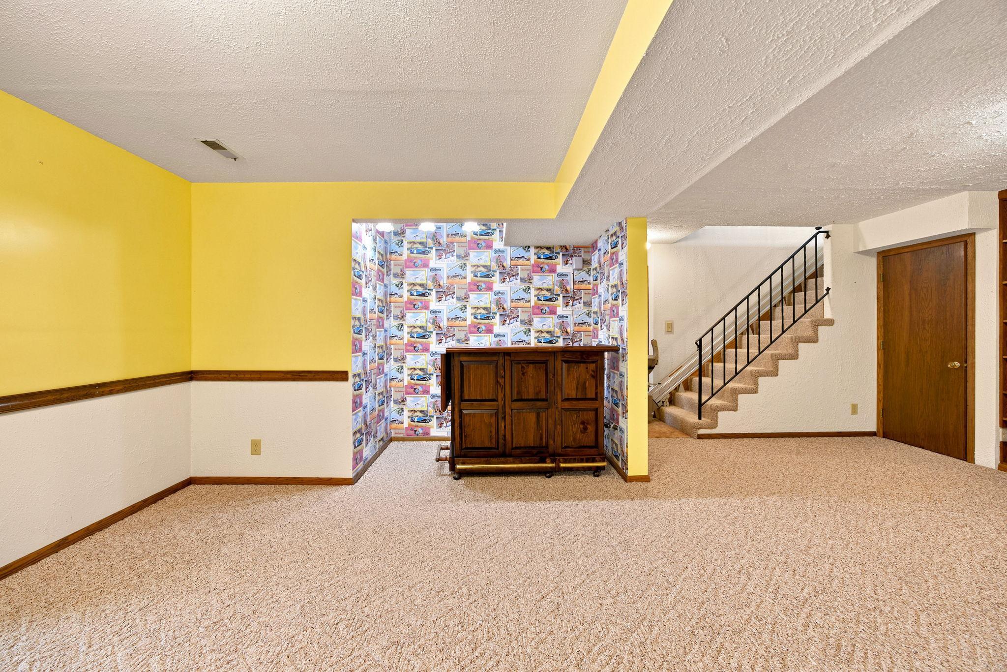 Lower level rec room with bar area.