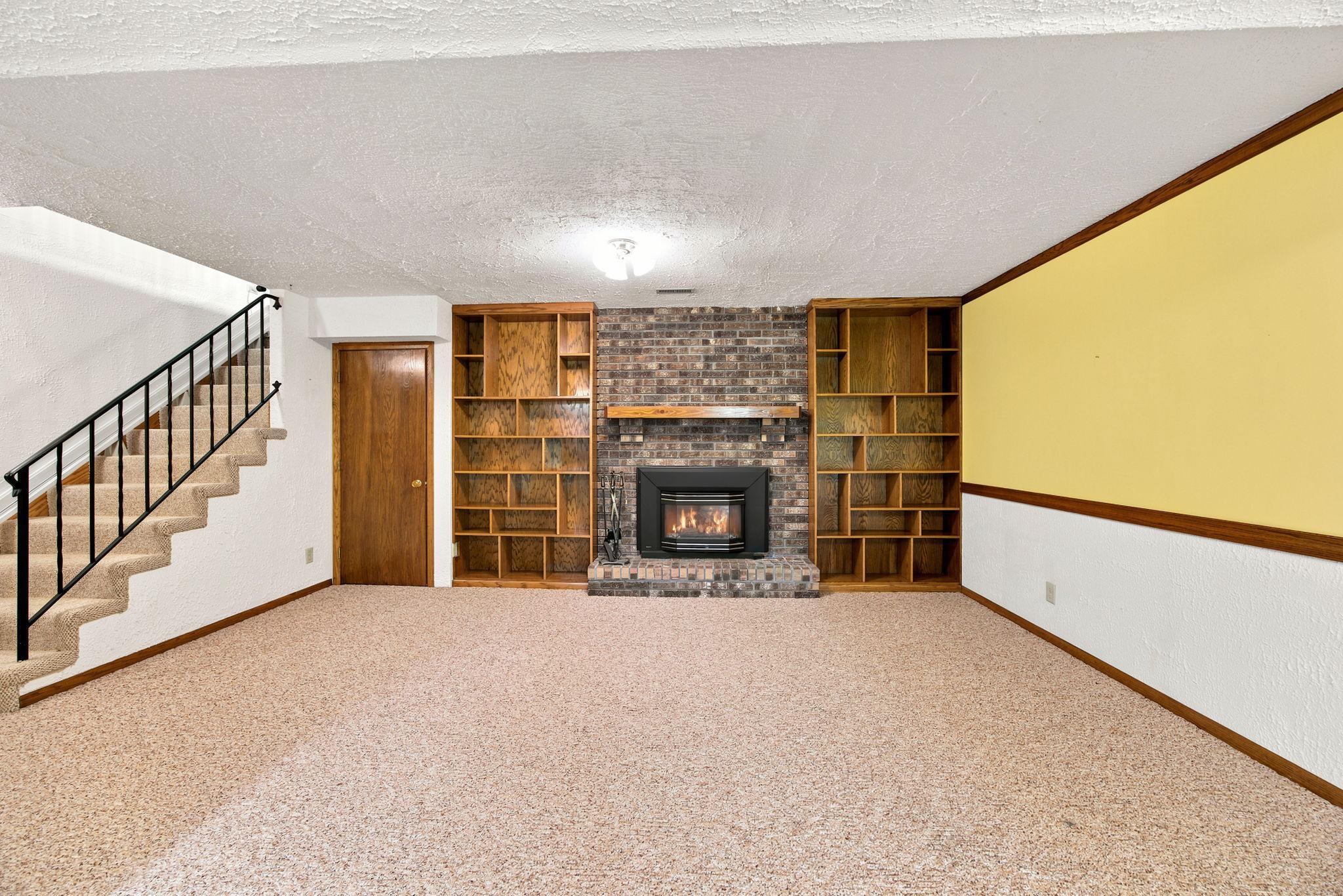 Family room with cozy fireplace.