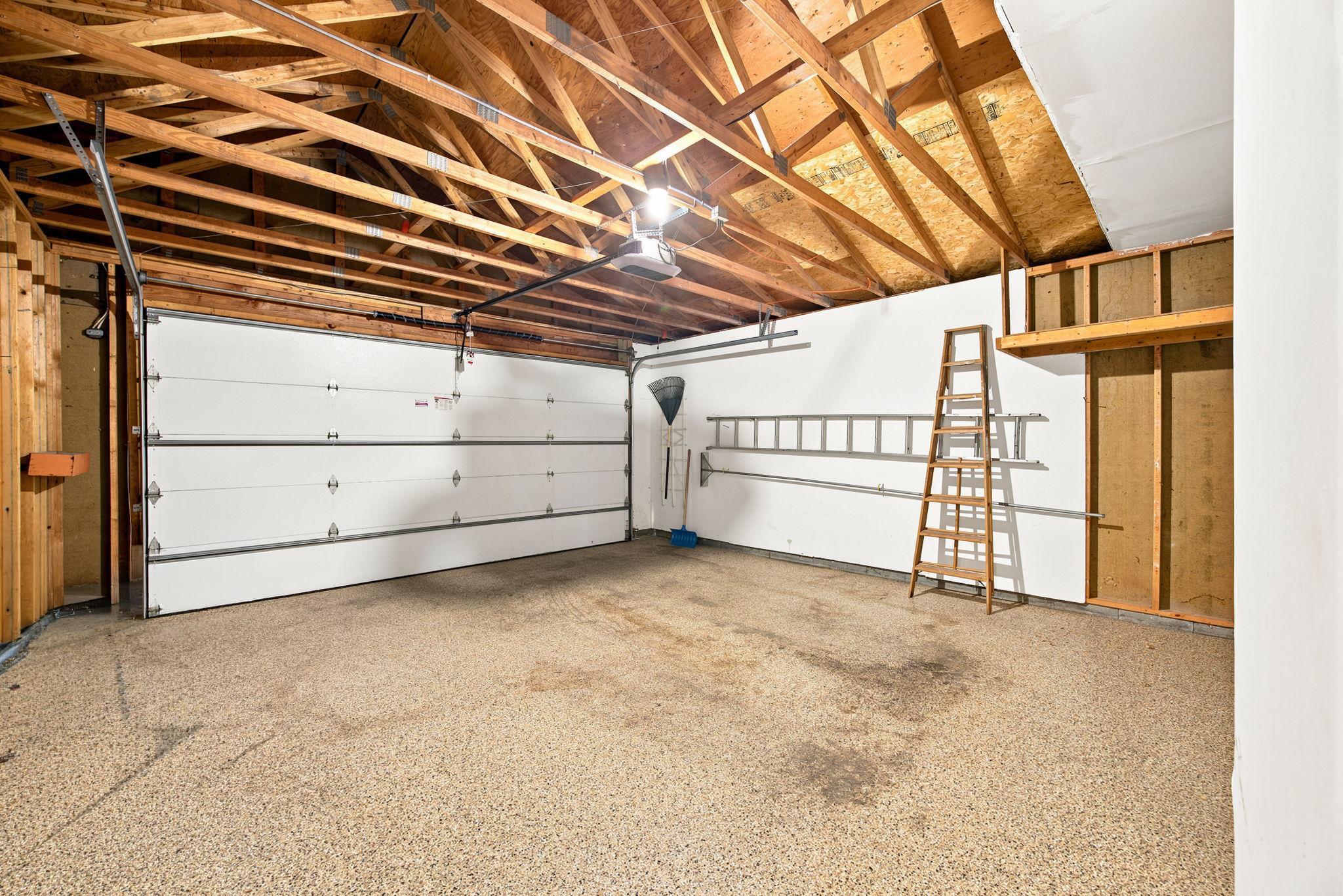 Garage has finished flooring.