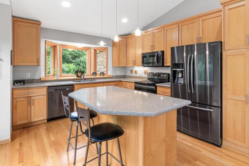 Custom cabinetry and quality finishes throughout. Large center island is perfect for morning coffee and reading the paper. Newer appliances and great solid surface countertops.