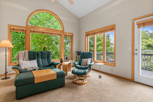 Four-season porch overlooking the peaceful backyard.