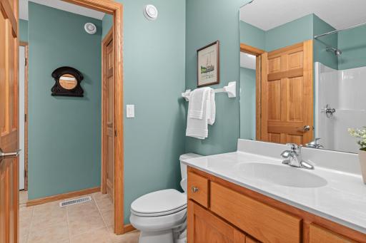 Main-level bathroom includes a shower and is perfect for guests.