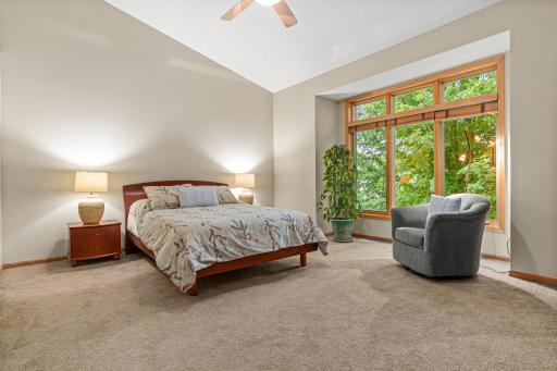 A wall of windows brings the outdoors in and provides a natural backdrop to the owner's suite. One-level living at its finest. A true respite at the end of the day.