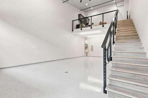 A finished mezzanine can become your own kitchen, lounge, office, or gathering space above it all.