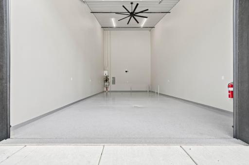 High ceilings, oversized doors, and durable finishes create a space built to handle everything from everyday storage to prized collections.