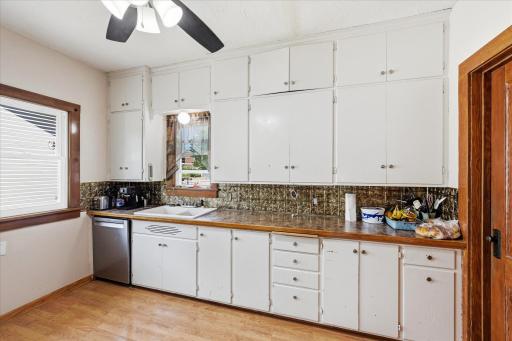 Kitchen updates include newer countertops, stainless refrigerator and dishwasher.