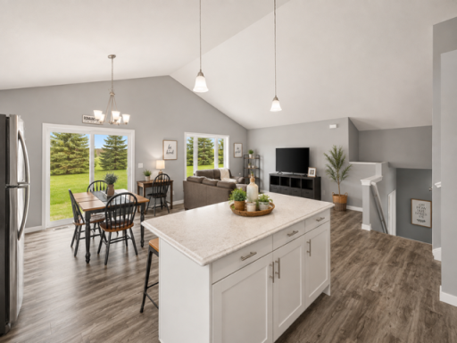 Center island open to living area and kitchen