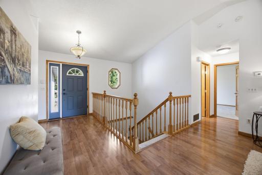 This move-in ready home blends space and style with nearly 2,000 square feet of living space. To the right is access to the primary bedroom, 2nd bedroom and full bathroom.