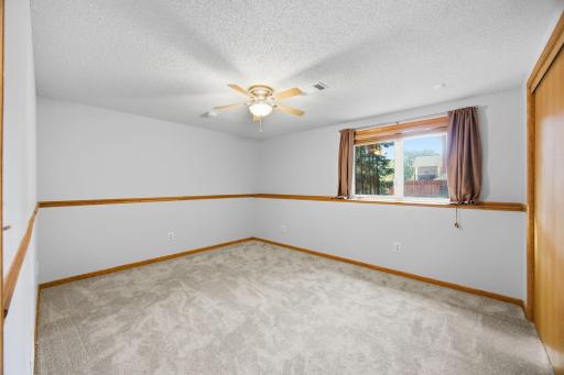 Lower-level bedroom with new carpet!