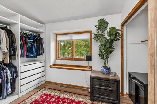 2nd bedroom currently used as a dressing room with built in cabinets