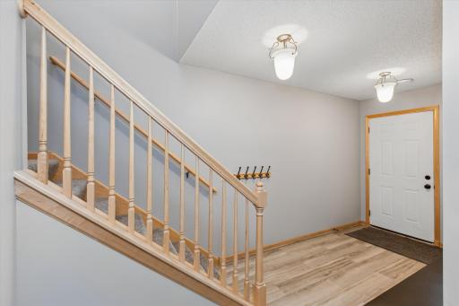spacious foyer with updated laminate floor