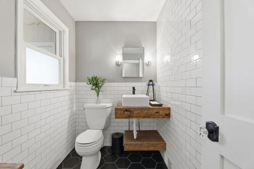 1/2 bath off the kitchen and next to enclosed heated porch