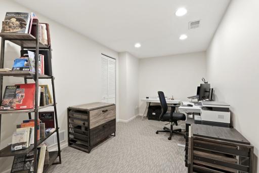 This room is currently an office, could be a craft room or make it into the exercise room