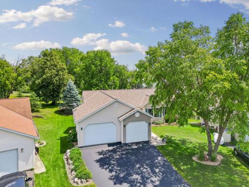 Mature trees and lush landscaping provide privacy and beauty.