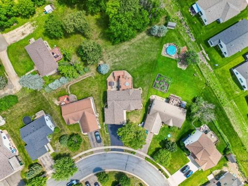 A bird's-eye view of the spacious backyard and beautifully maintained landscaping.