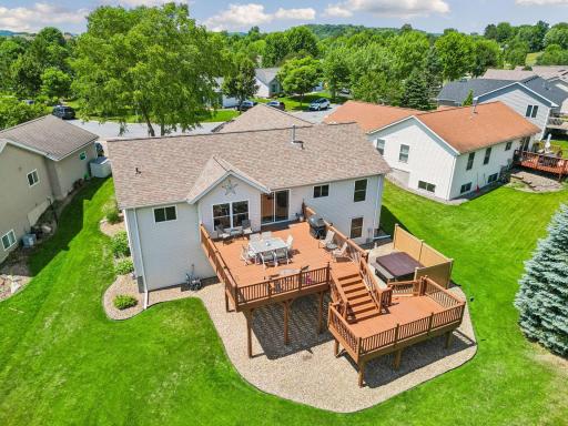 An entertainer's dream with a spacious two-tier deck overlooking the backyard.
