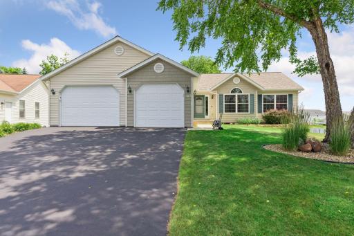 Welcome home! Oversized garage, spacious driveway, and fantastic curb appeal.