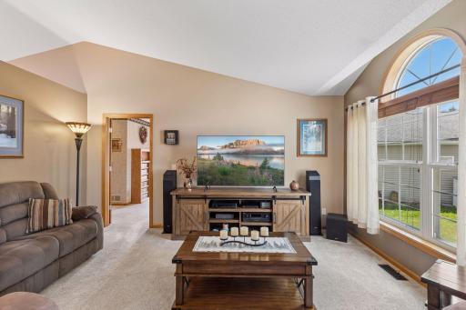 A spacious living room filled with natural light.