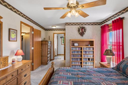 A large primary bedroom with walk-in closet and private bath.