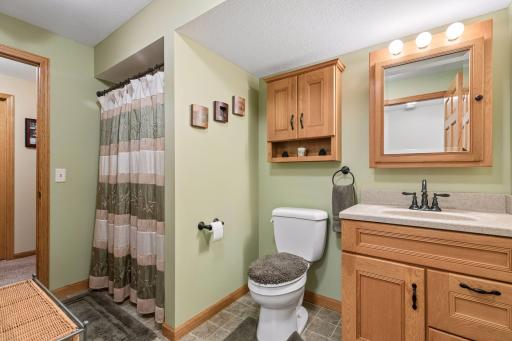 A beautifully maintained three-quarter bathroom on the lower level.