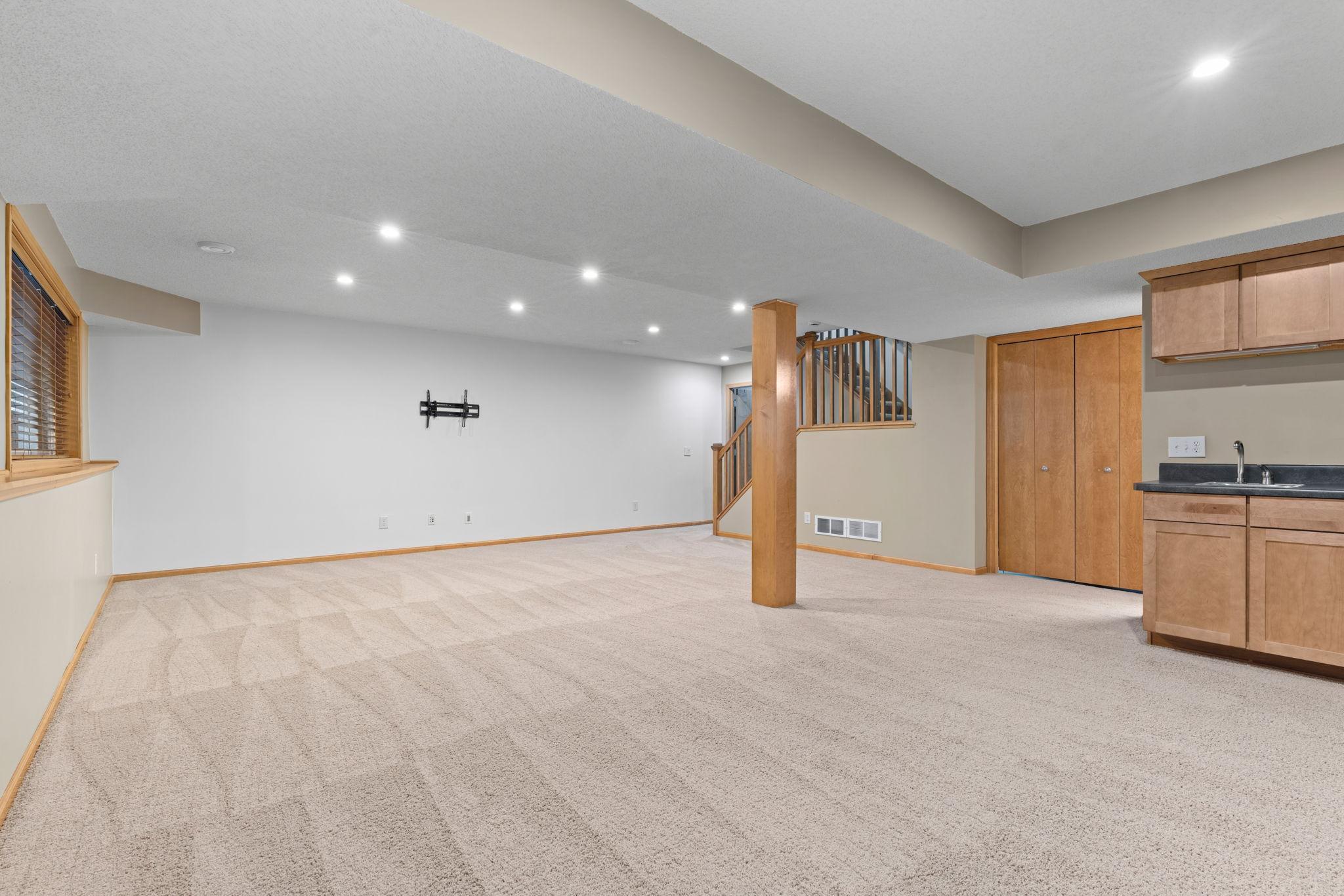 behind post / stairway in back of pic is a huge storage room