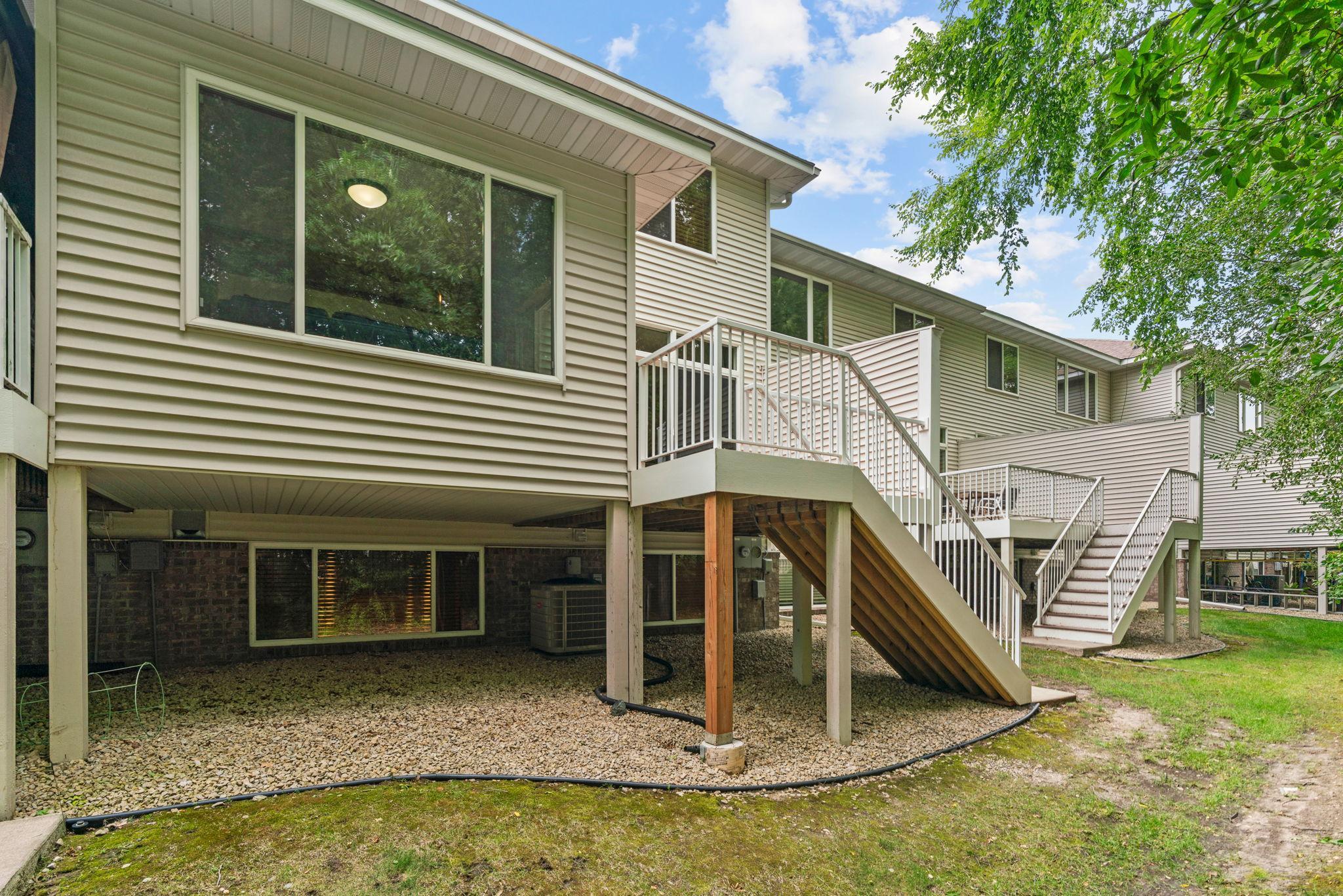 deck off stairs leading to yard