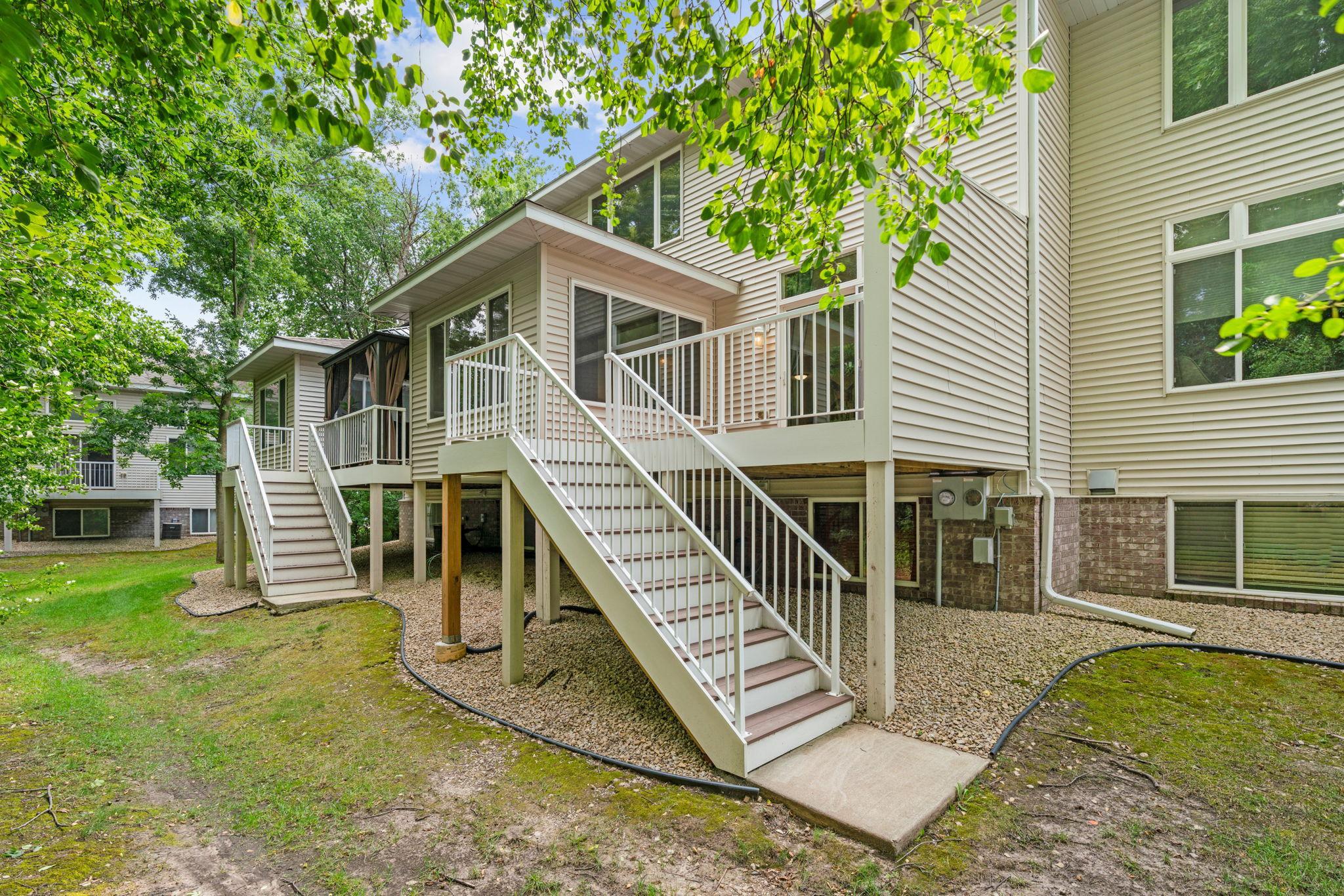 deck off stairs leading to yard