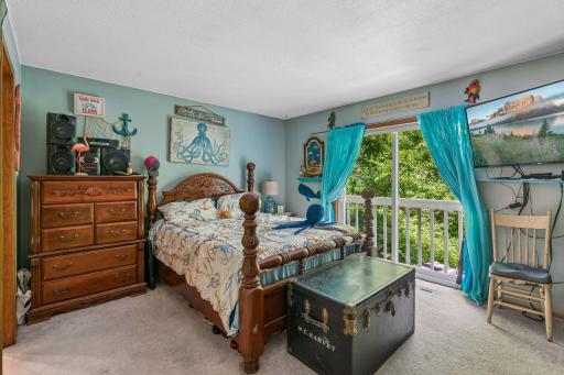 Primary bed/ bath ste features great closet space and large patio door opening to a deck.