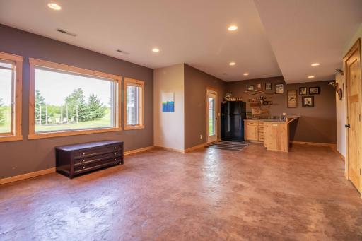 Lower-level great room with heated stamped concrete flooring
