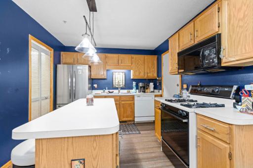 Kitchen area has ample cupboards and plenty of counter space