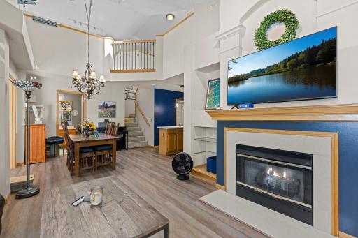 Beautiful fireplace is the focal point of the generously sized living room
