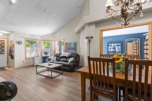 View of the living room from dining area - many windows letting in lots of light!