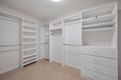 Primary bedroom walk in closet