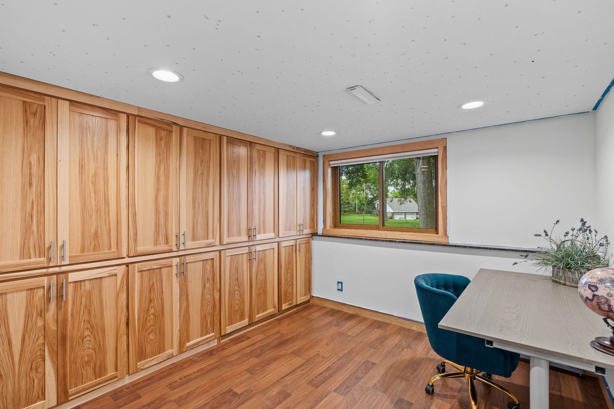 2nd bedroom in lower level - wall of storage! Great as a home office or craft area!