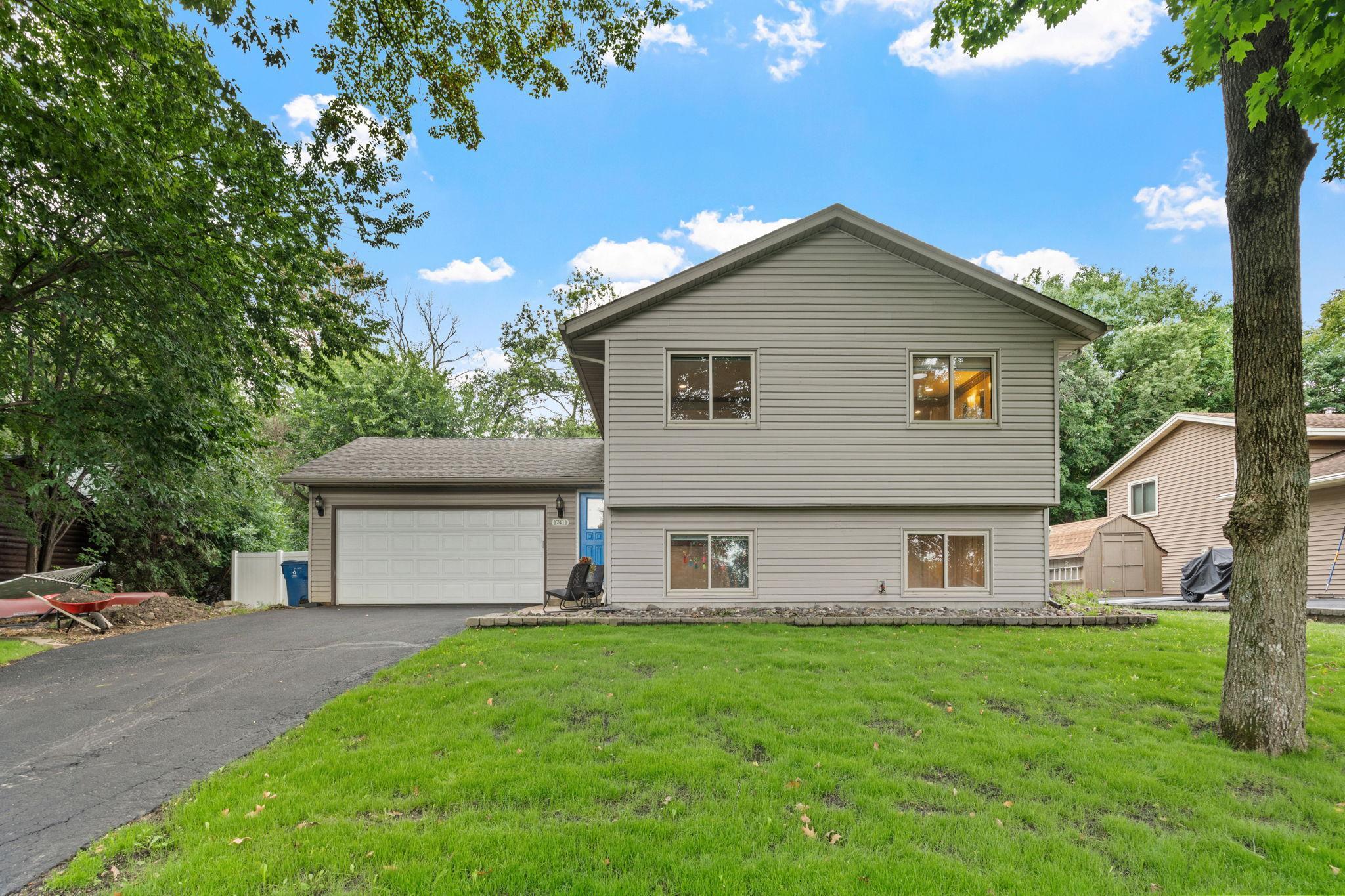 Driveway resealed in August! Don't miss the bonus space on the side of the garage for additional storage, parking, or add a shed!