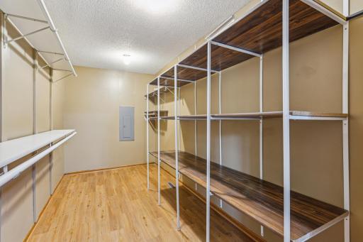 Primary bedroom walk in closet