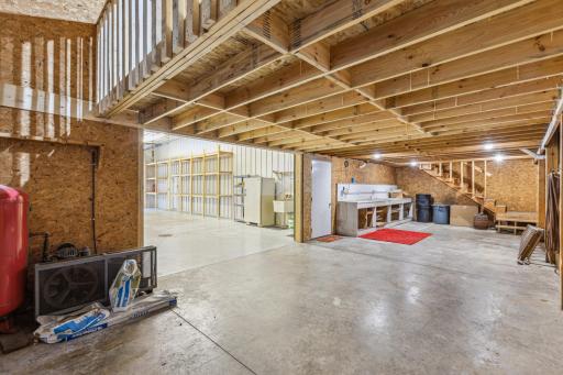 Storage area with workbench and air compressor.